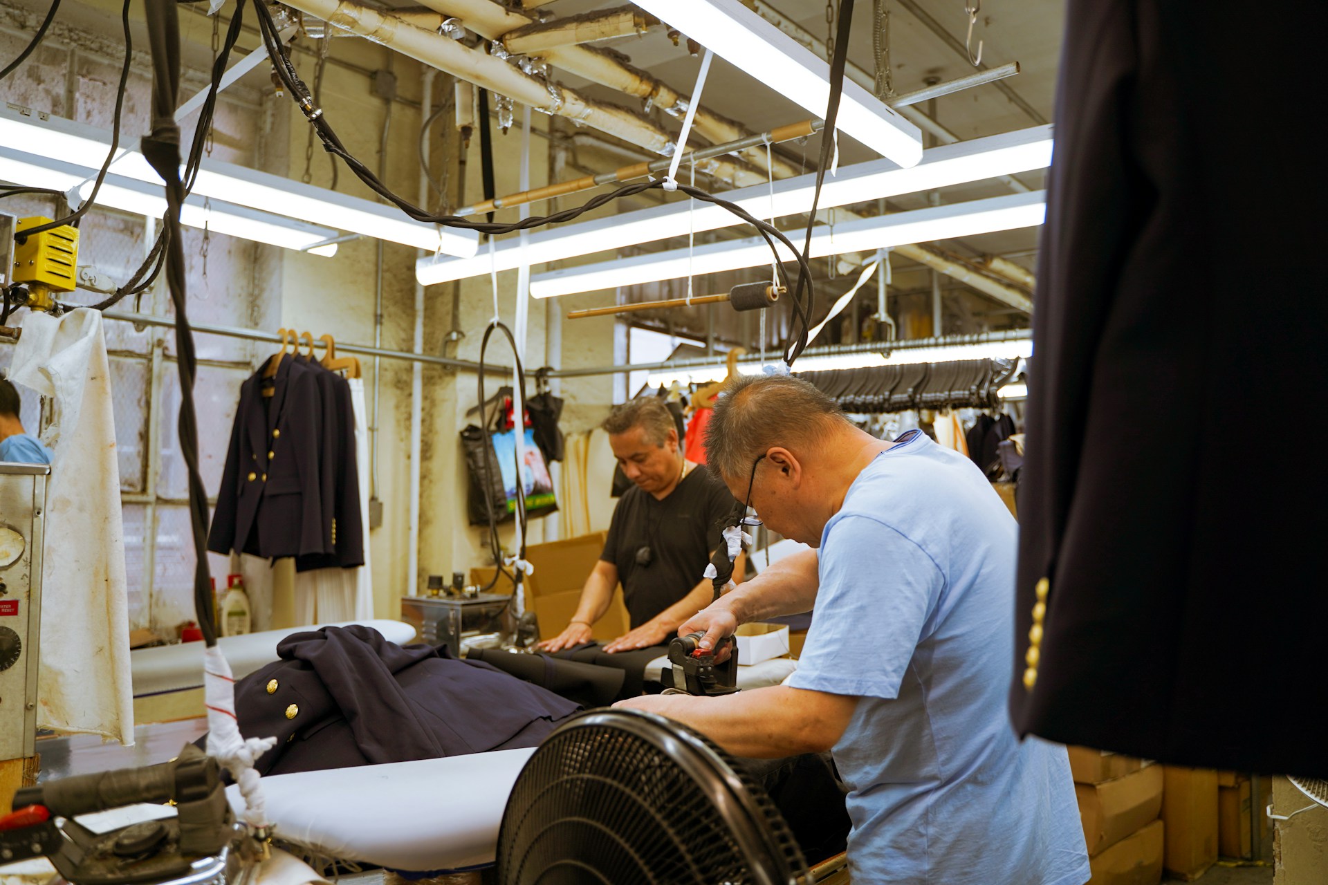 A group of men working on a machine in a factory