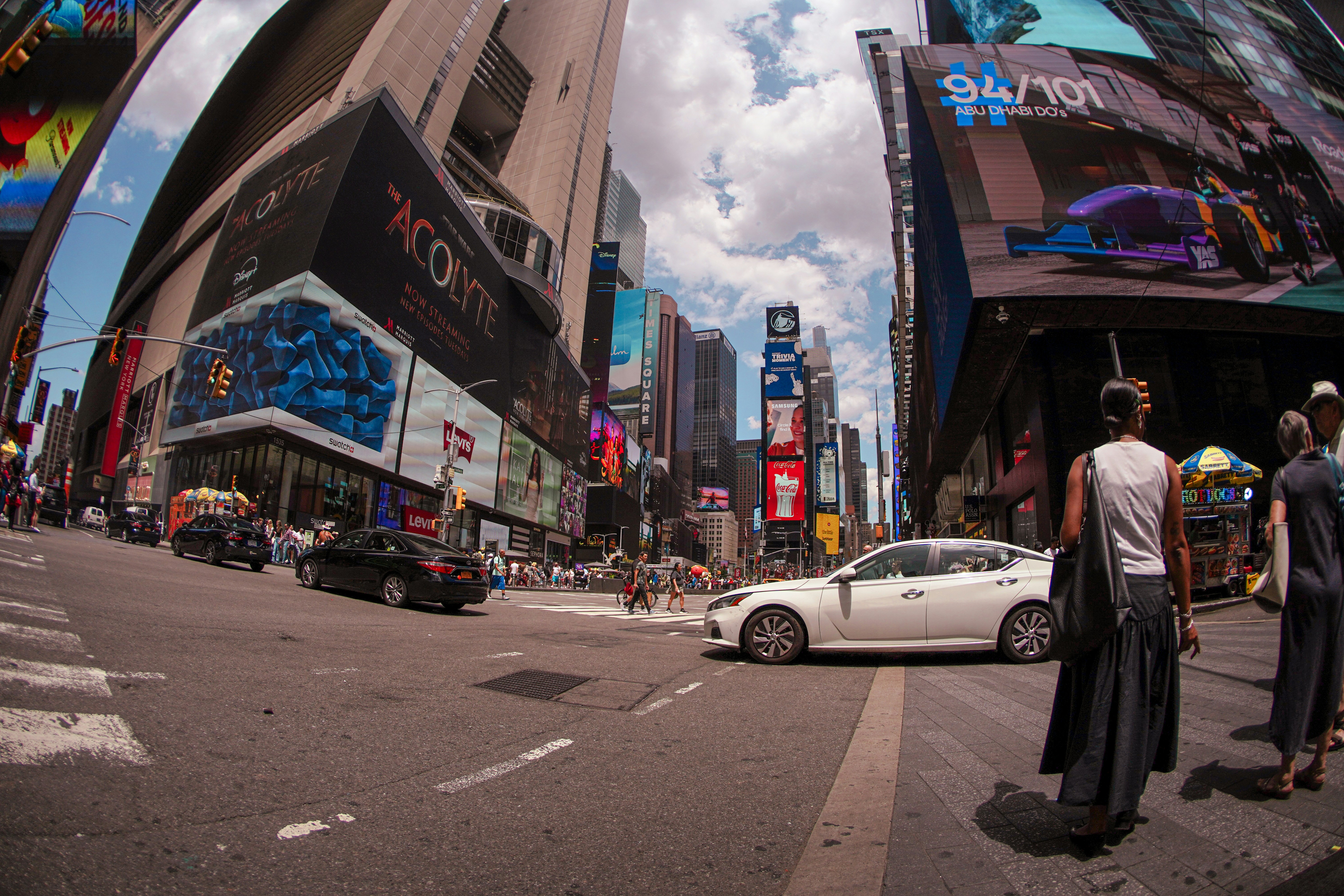 A couple of people that are standing in the street
