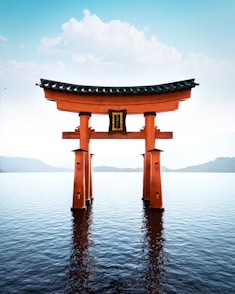 A large red tori tori floating on top of a body of water