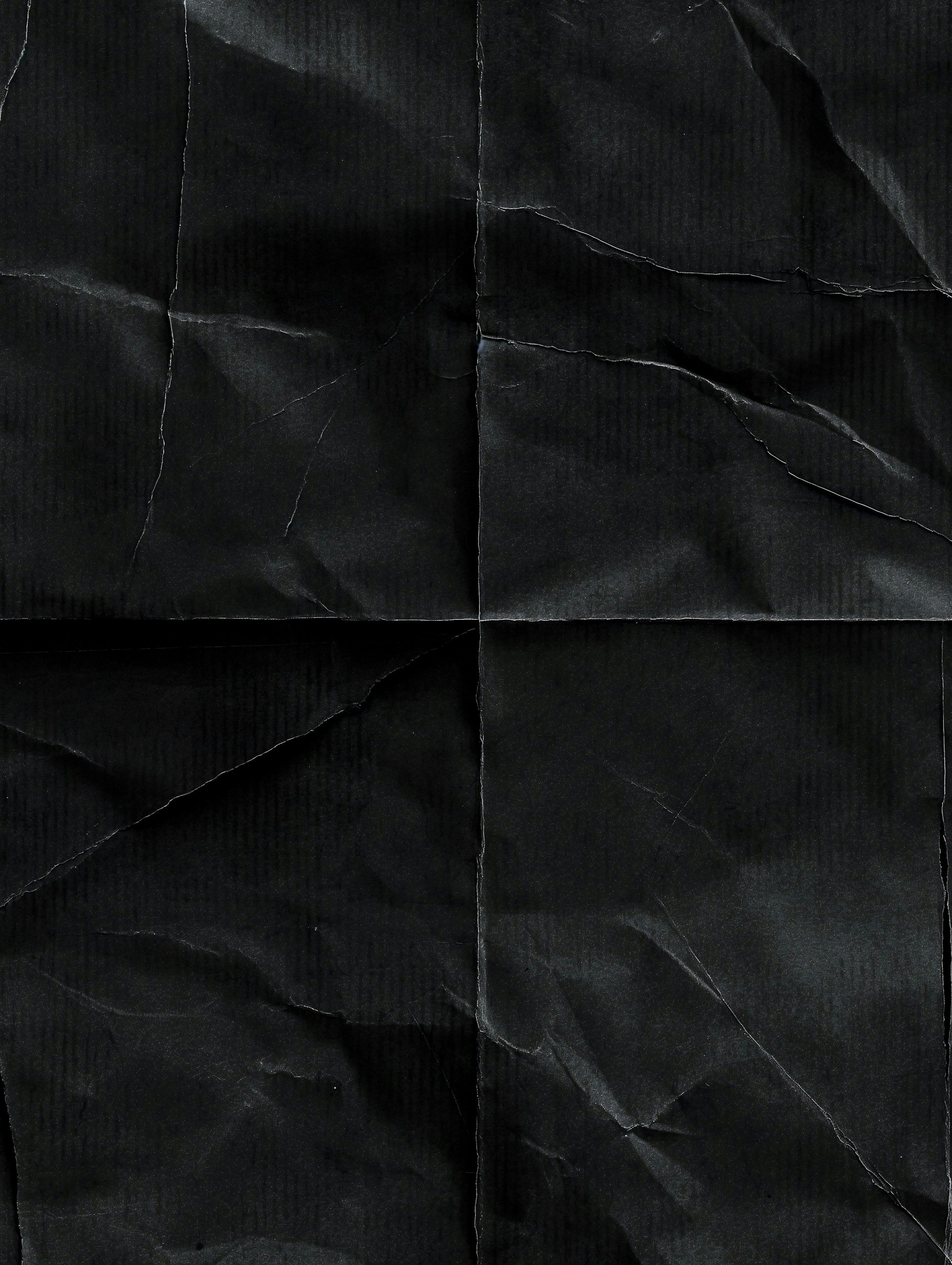 A piece of black paper that has been folded