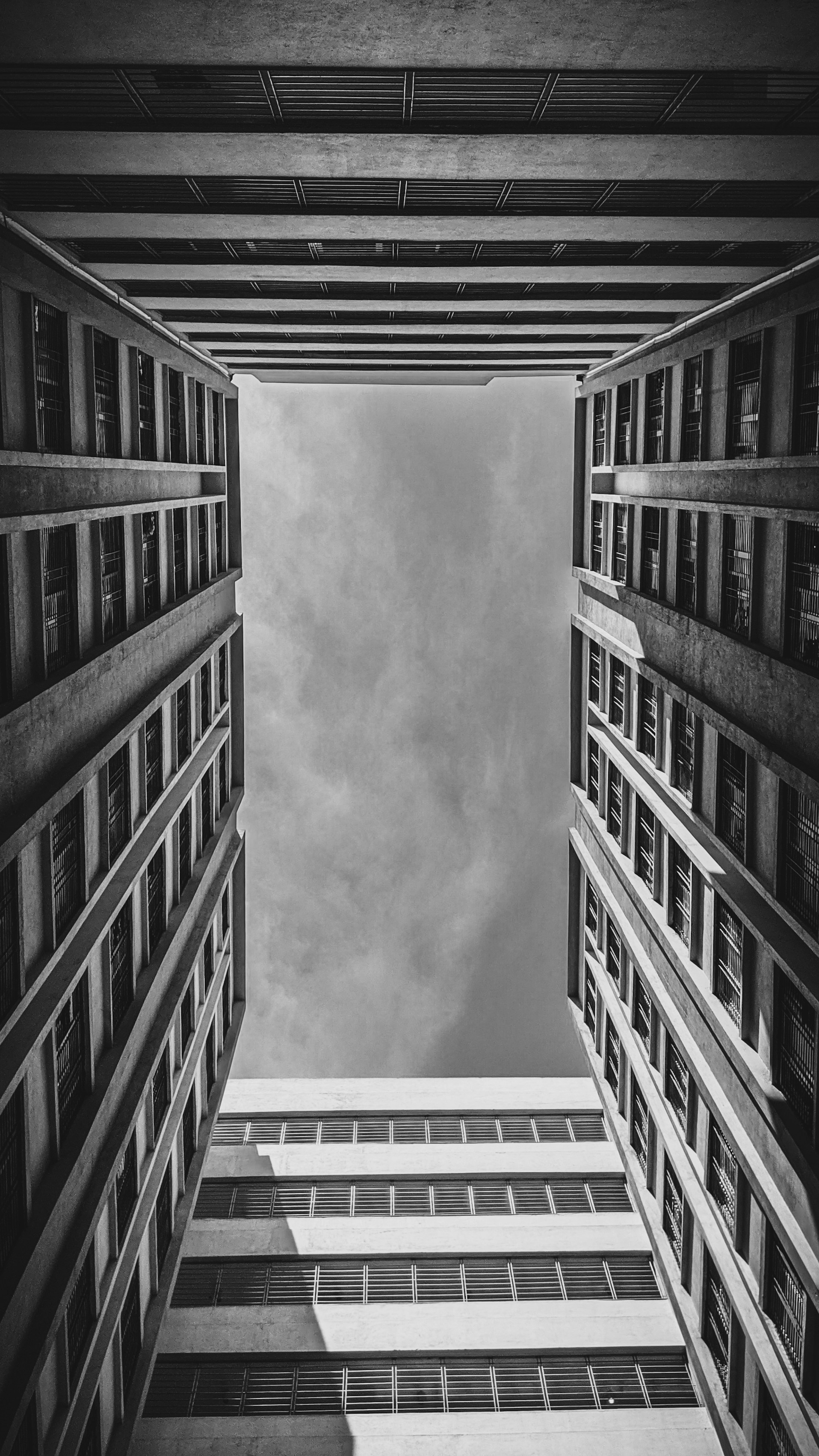 A black and white photo of a tall building