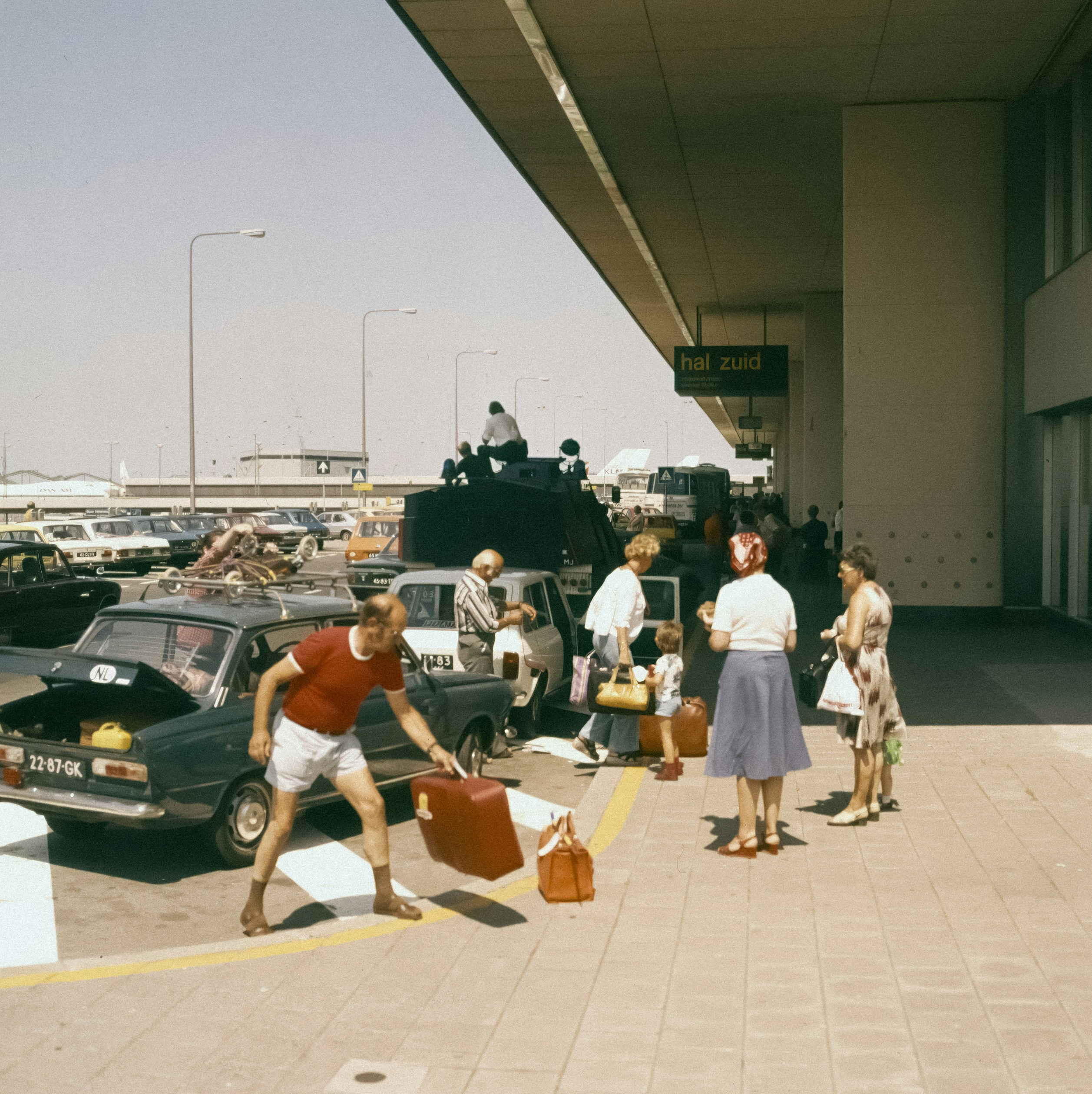 Taxi and rideshare vehicles parked outside the airport