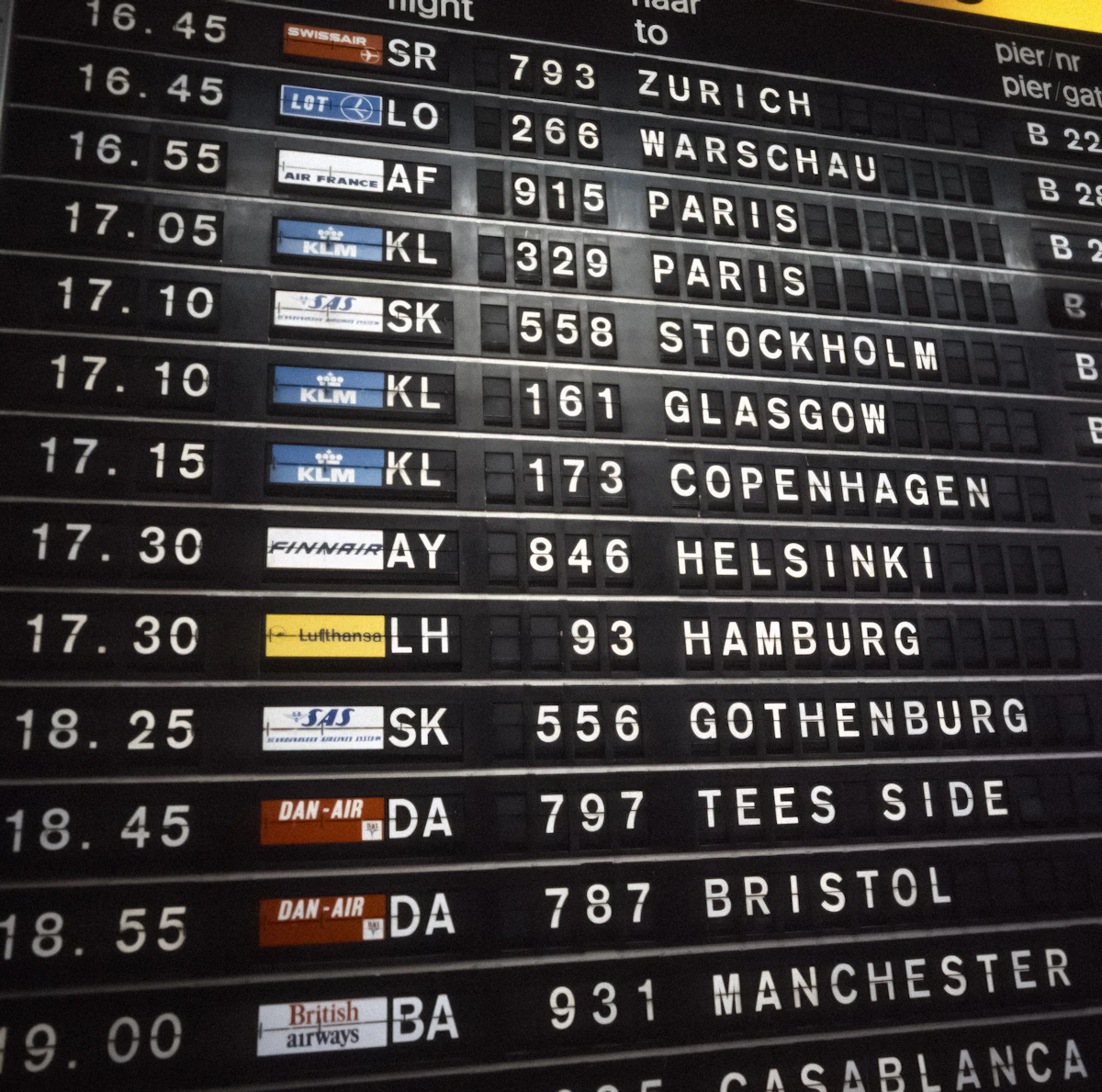 Airport departure board displaying flight information