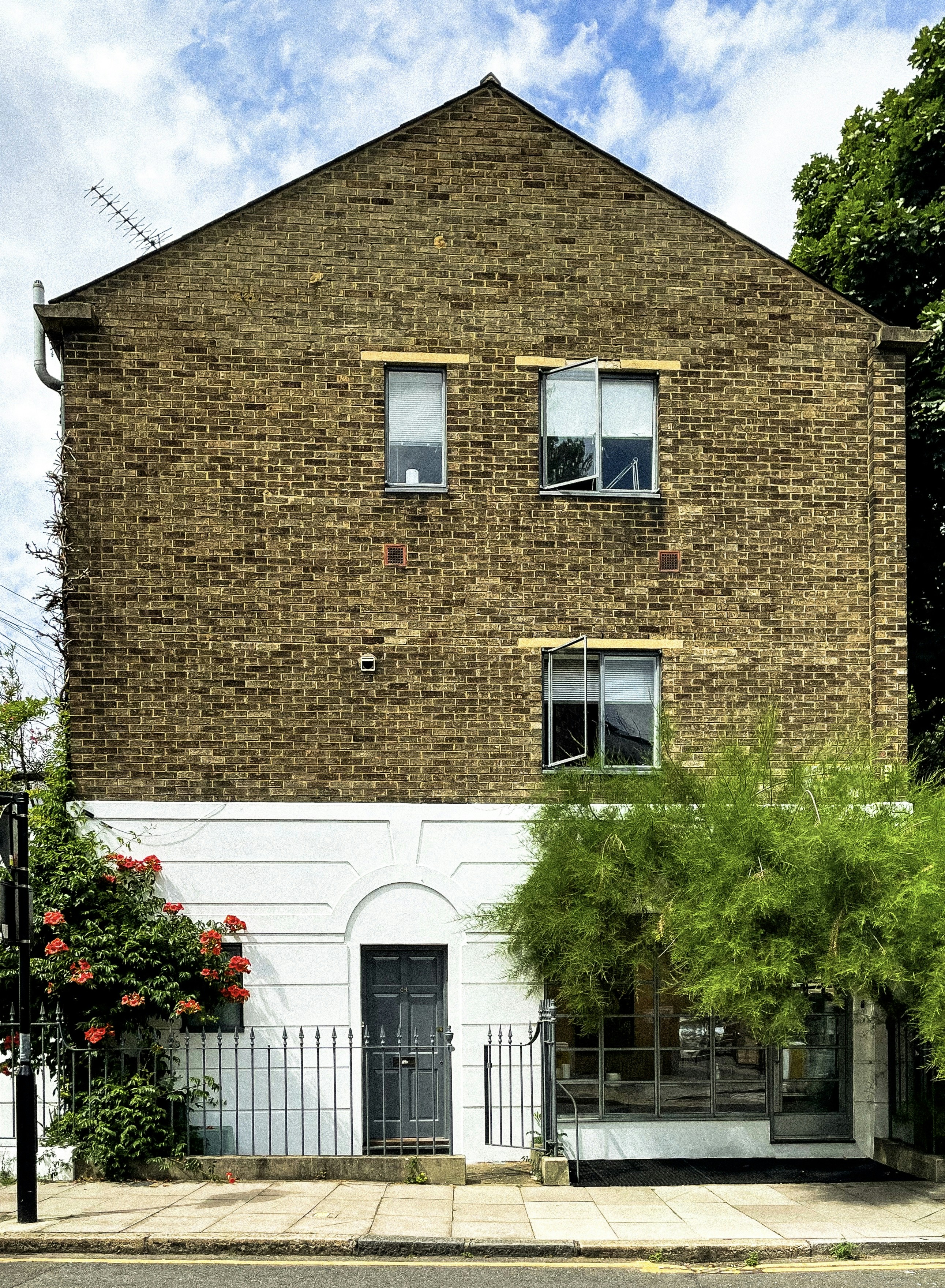 A tall brick building with lots of windows