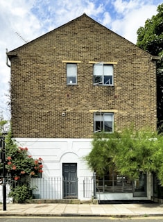 A tall brick building with lots of windows