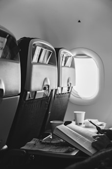 A black and white photo of an airplane seat