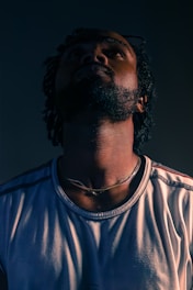 A man with a beard wearing a white shirt