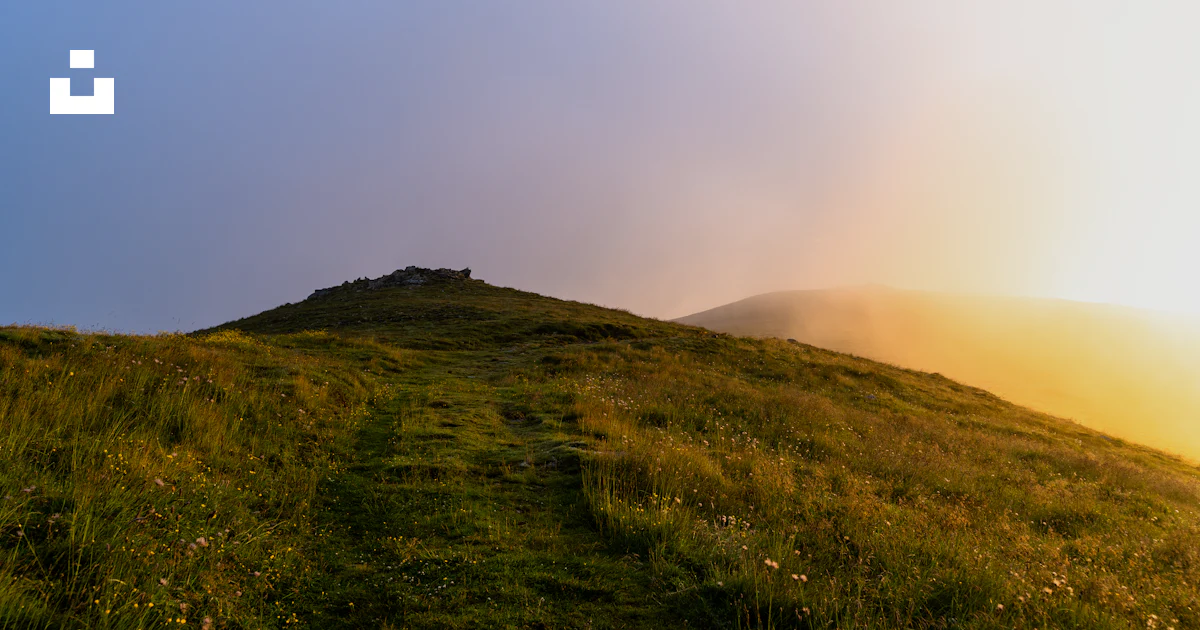 Small Hill Ranges A grassy hill with a small hill in the distance photo – Free Nature ...