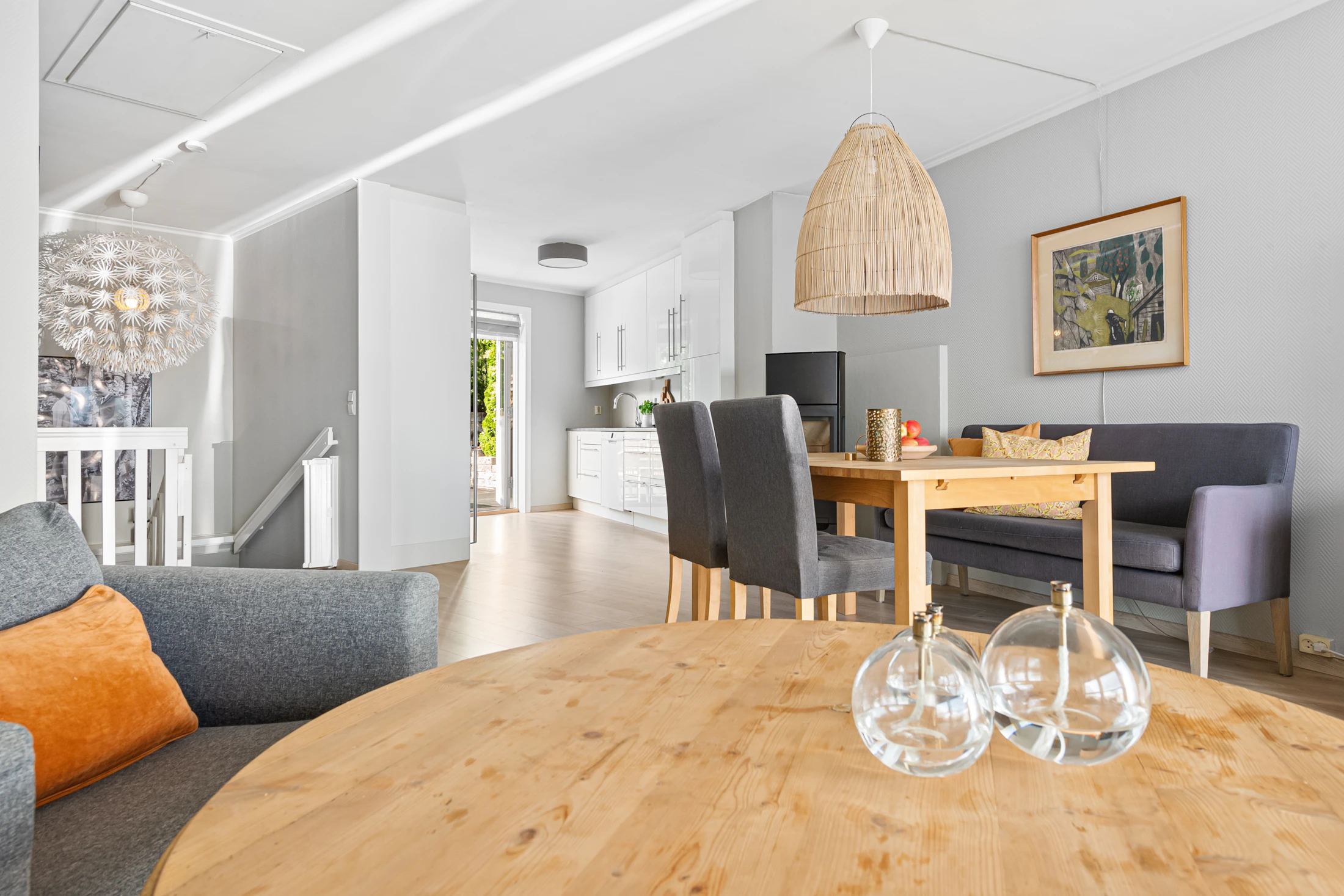 Warm complete living and dining interior with natural furniture