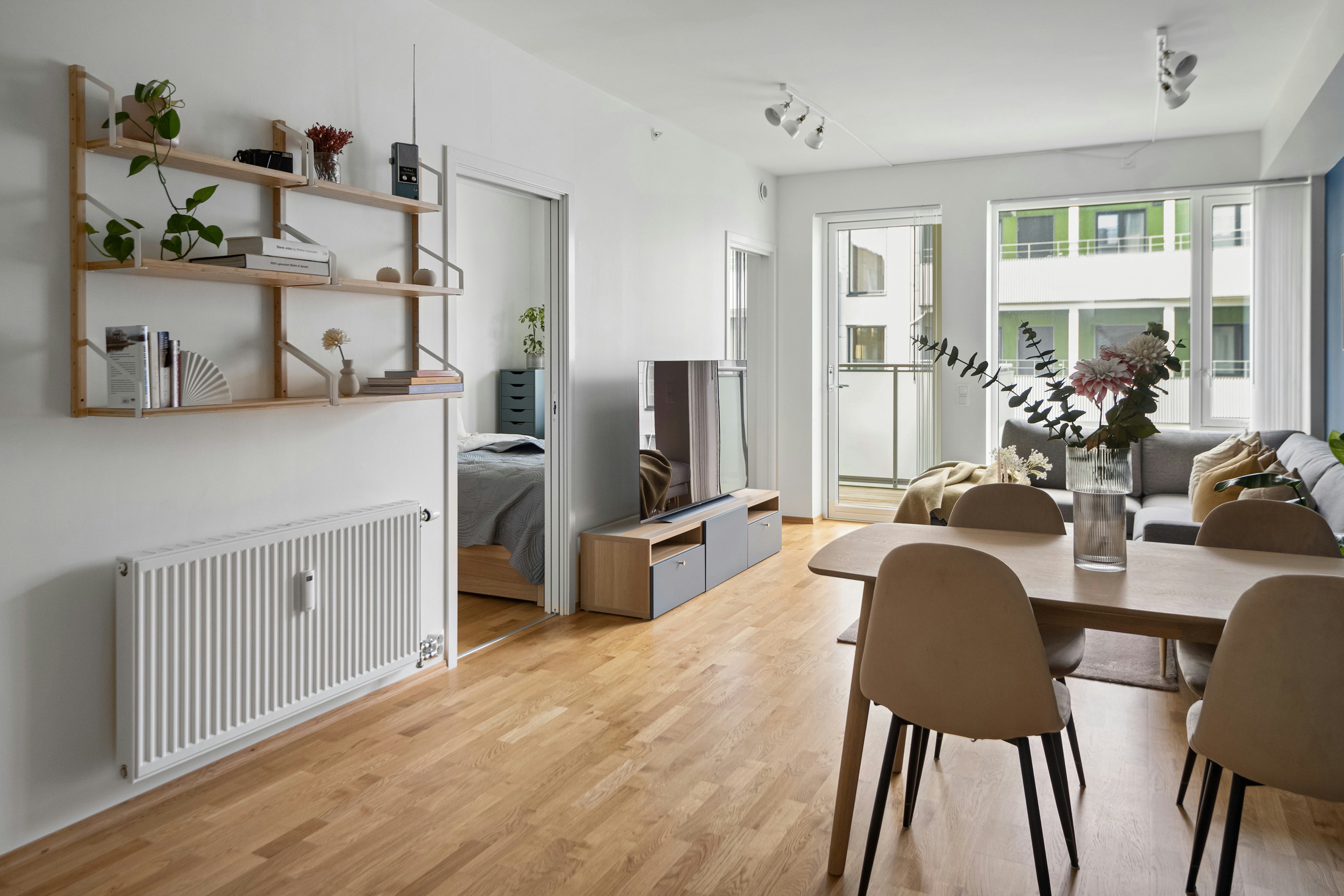 A living room filled with furniture and a wooden floor