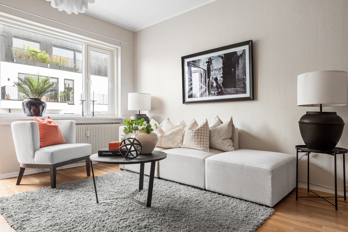 Modern living room with large window and framed photo