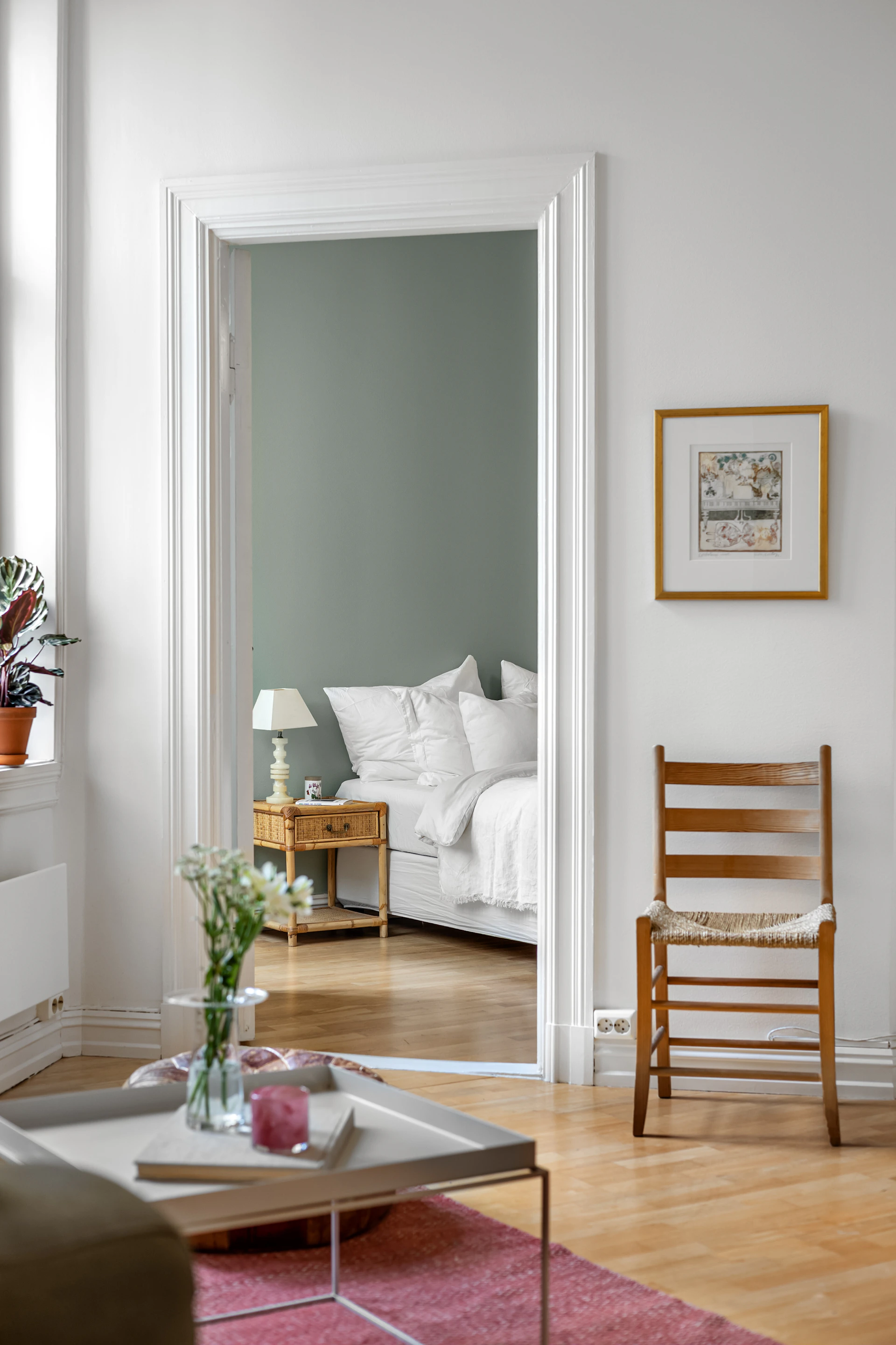 A living room filled with furniture and a mirror