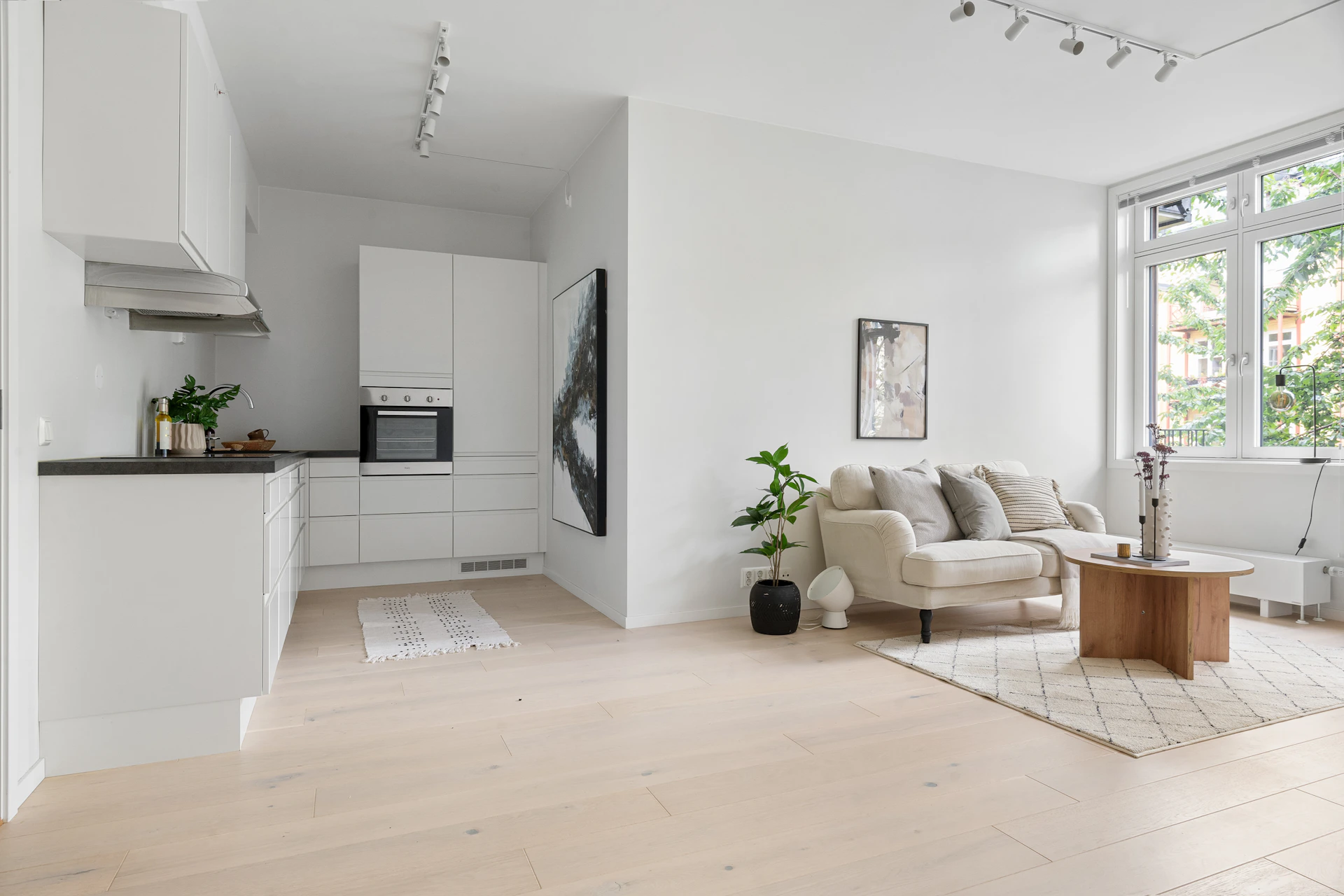A living room filled with furniture and a large window