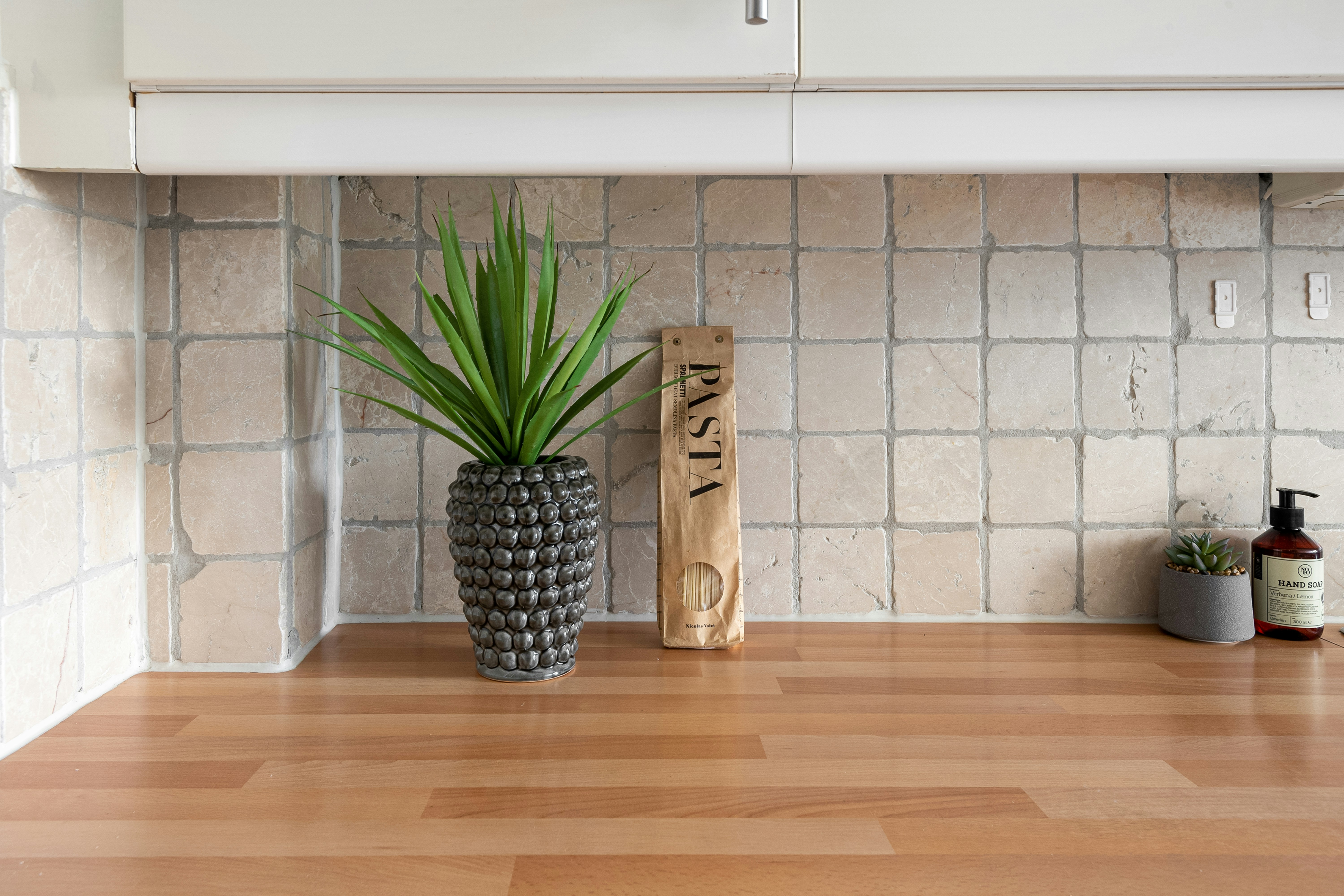 A potted plant sitting on top of a wooden floor