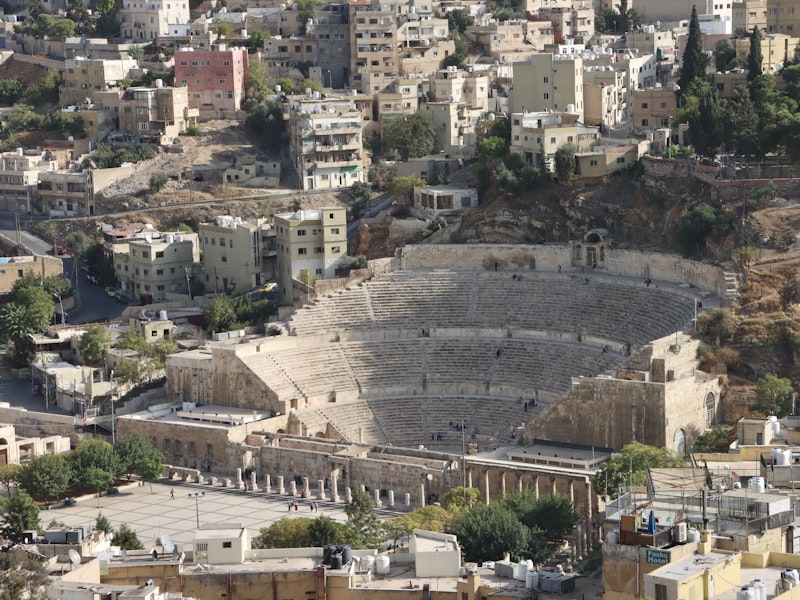 Amman cityscape with ancient Roman Theatre and modern buildings