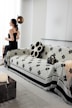 A woman sitting on a couch in a living room