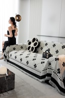 A woman sitting on a couch in a living room