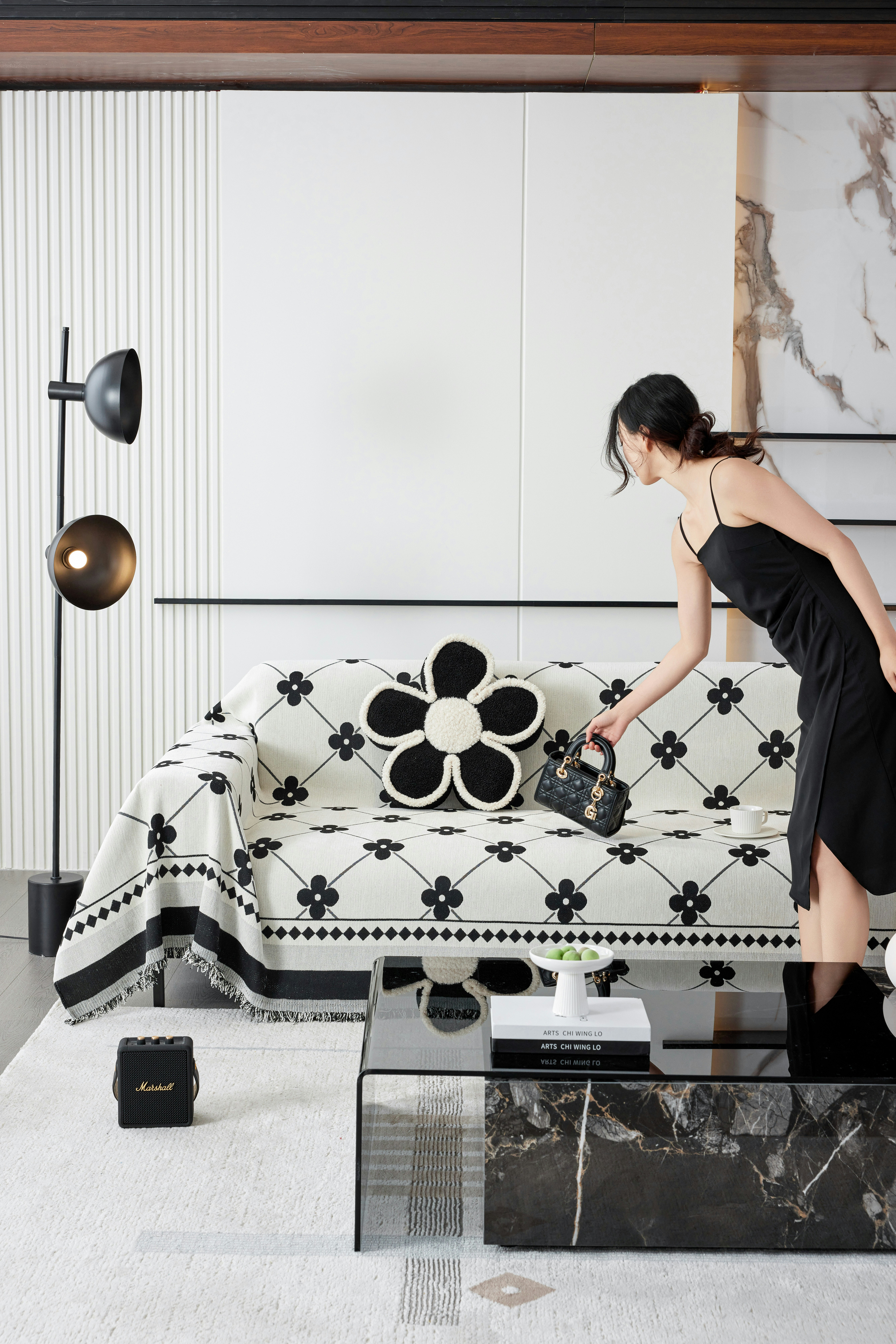 A woman in a black and white living room