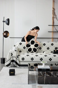 A woman sitting on a couch in a living room