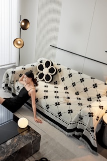 A woman laying on a bed in a room