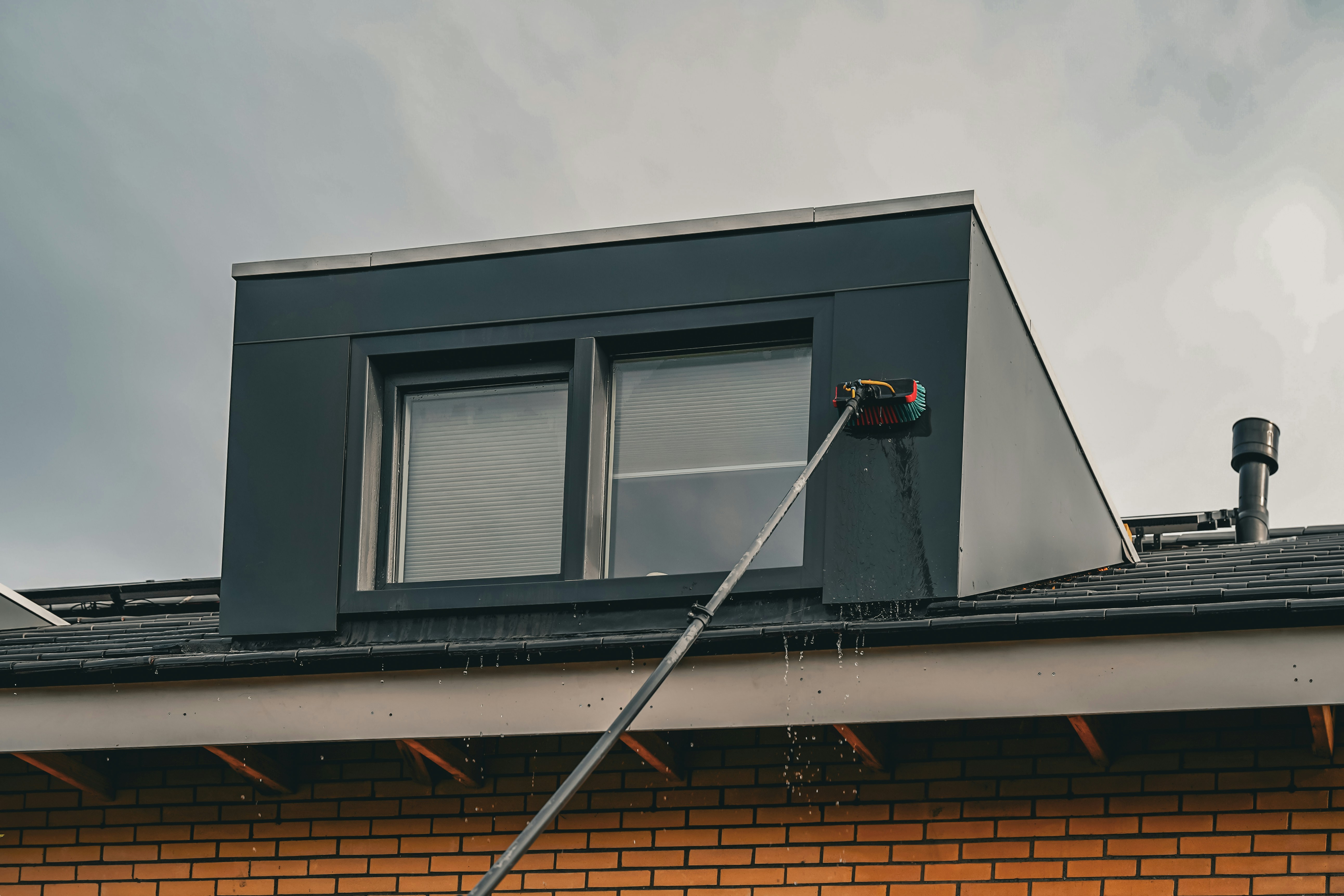 Professional installer applying solar film to a window