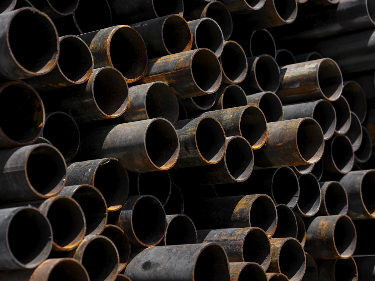 Stacked steel pipe — representative image