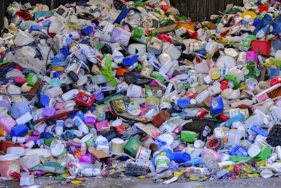 A pile of plastic bottles sitting on top of a street