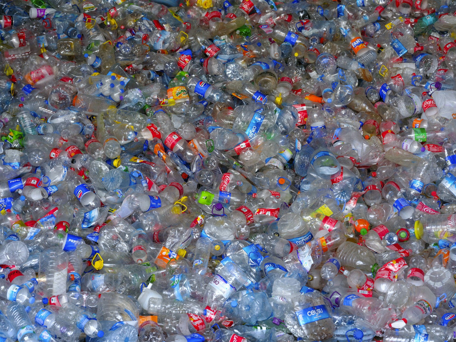 A pile of plastic bottles filled with water