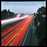 A blurry picture of a highway with a lot of traffic