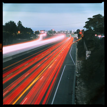 A blurry picture of a highway with a lot of traffic