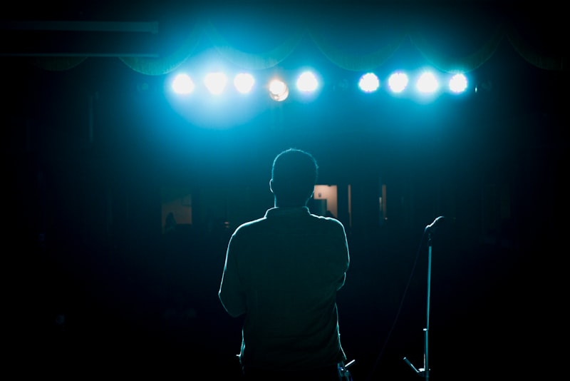 Dark stage atmosphere capturing the aggressive energy of Drill music