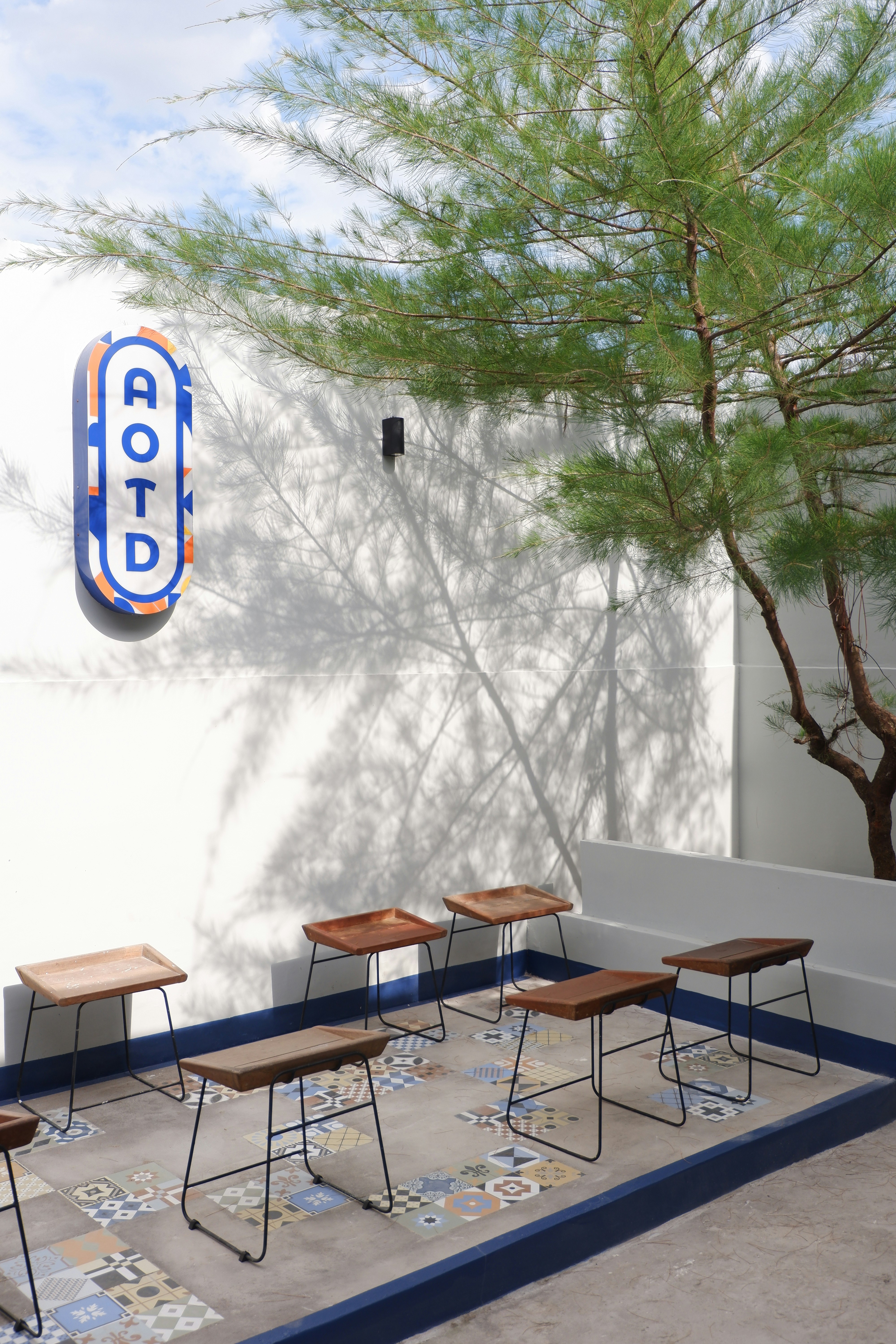 woman wearing yellow long-sleeved dress under white clouds and blue sky during daytime