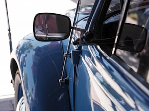 A close up of a car's side view mirror