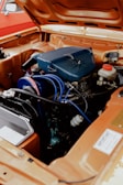 The engine compartment of a car with the hood open