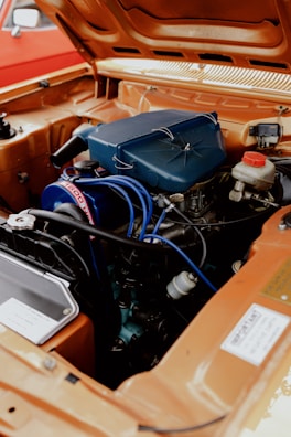 The engine compartment of a car with the hood open