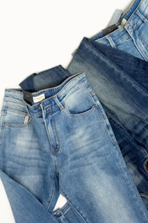 A pair of jeans sitting on top of each other
