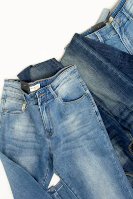 A pair of jeans sitting on top of each other
