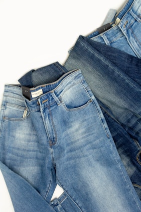 A pair of jeans sitting on top of each other