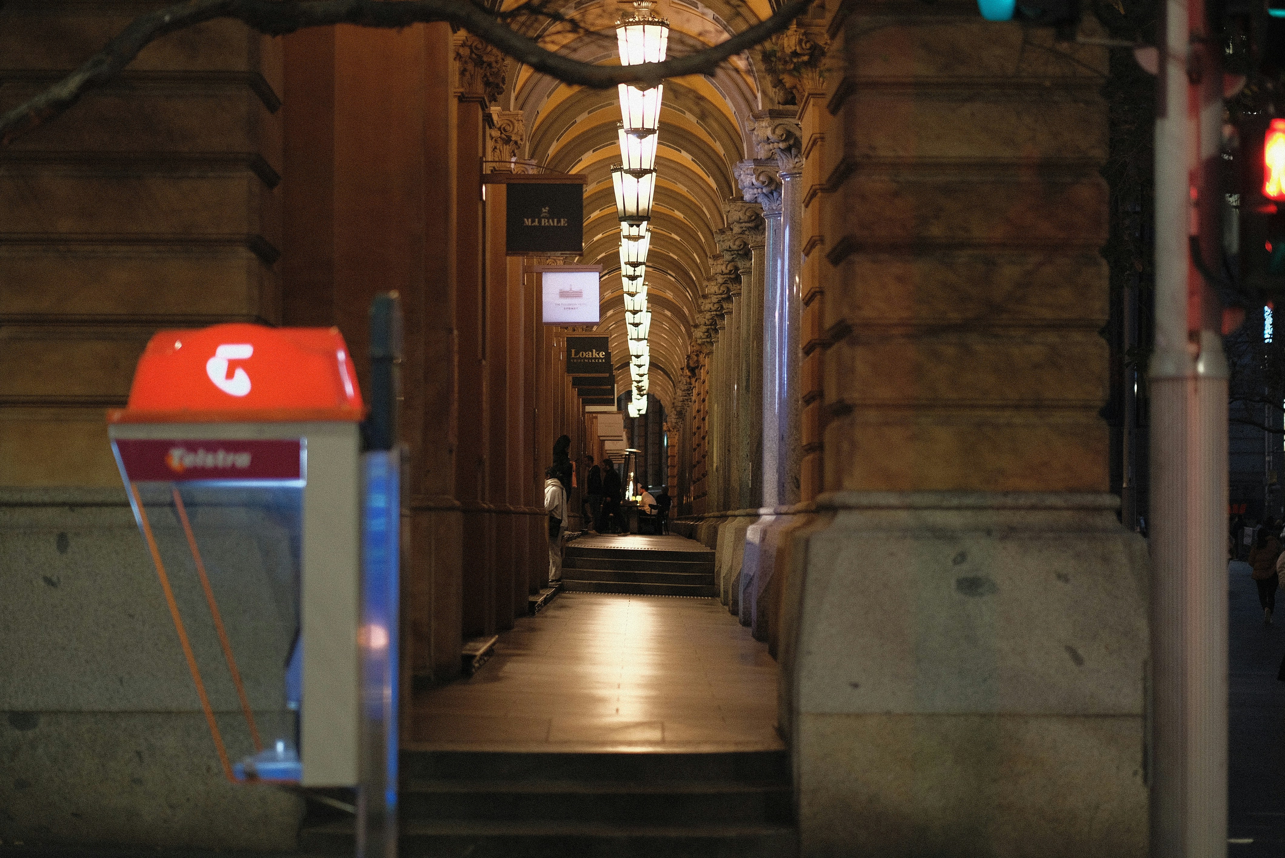 A long hallway with a red light at the end of it