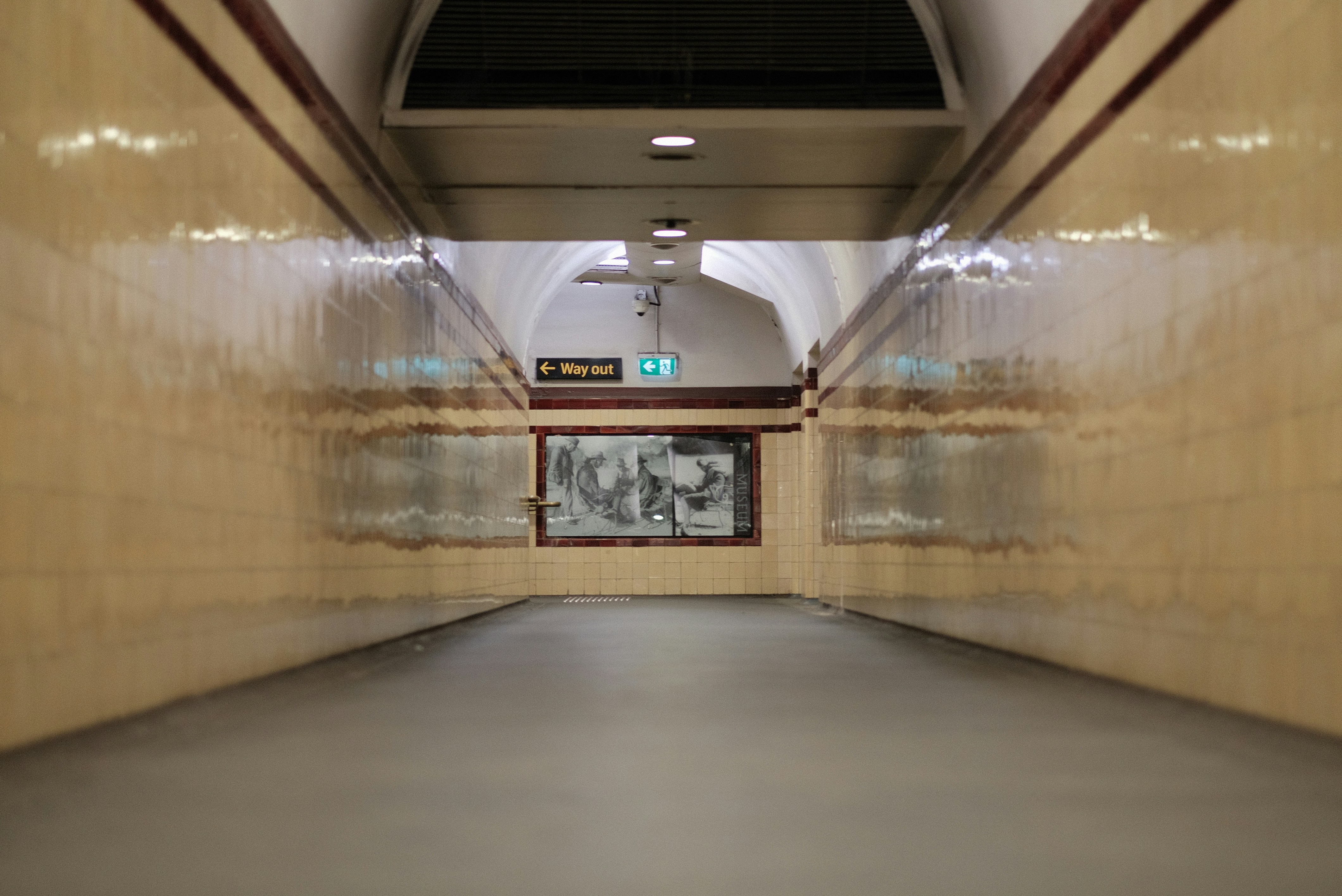 Long underground station passageway with a clock