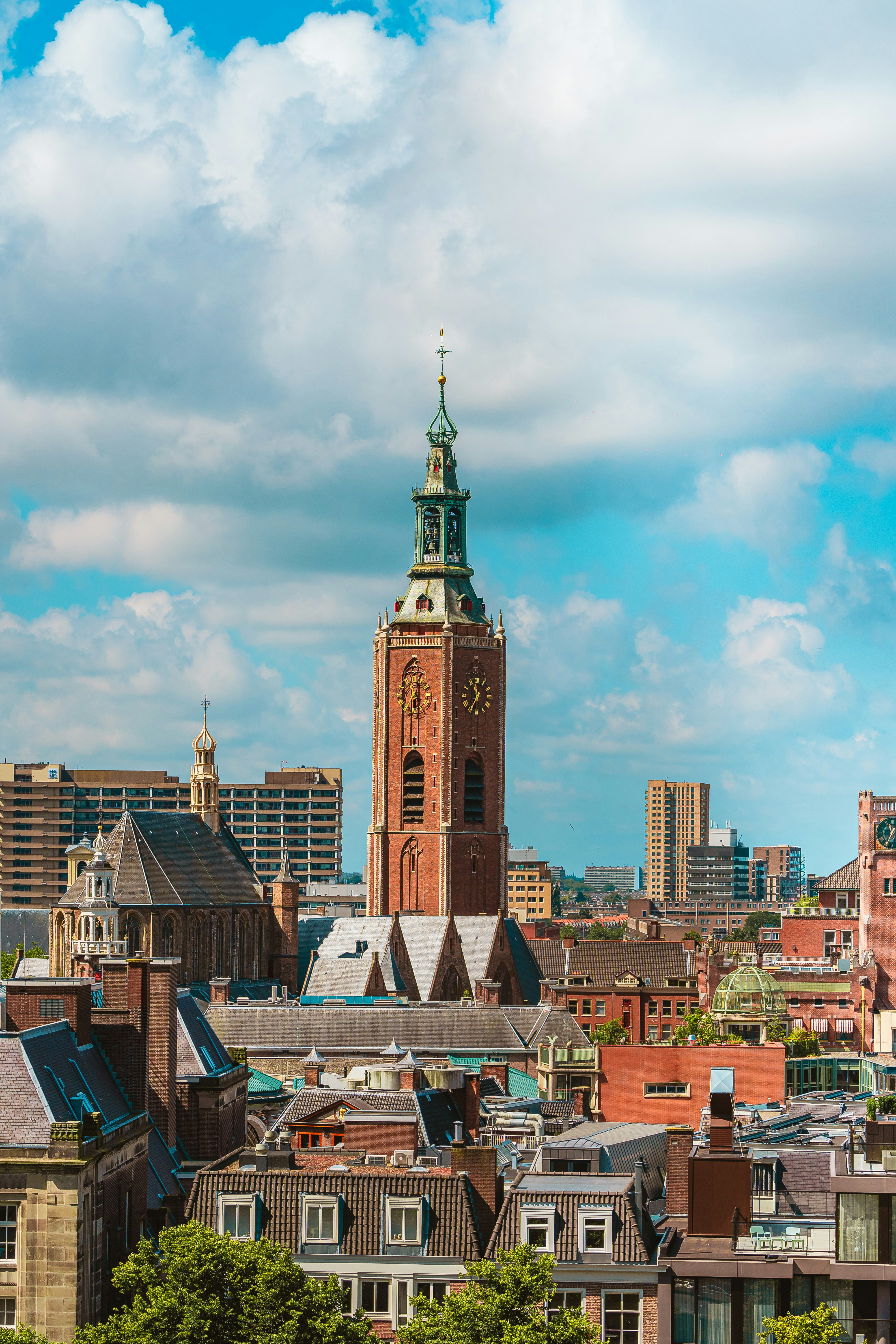 A view of a city with tall buildings and a clock tower