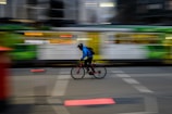 A blurry photo of a person riding a bike