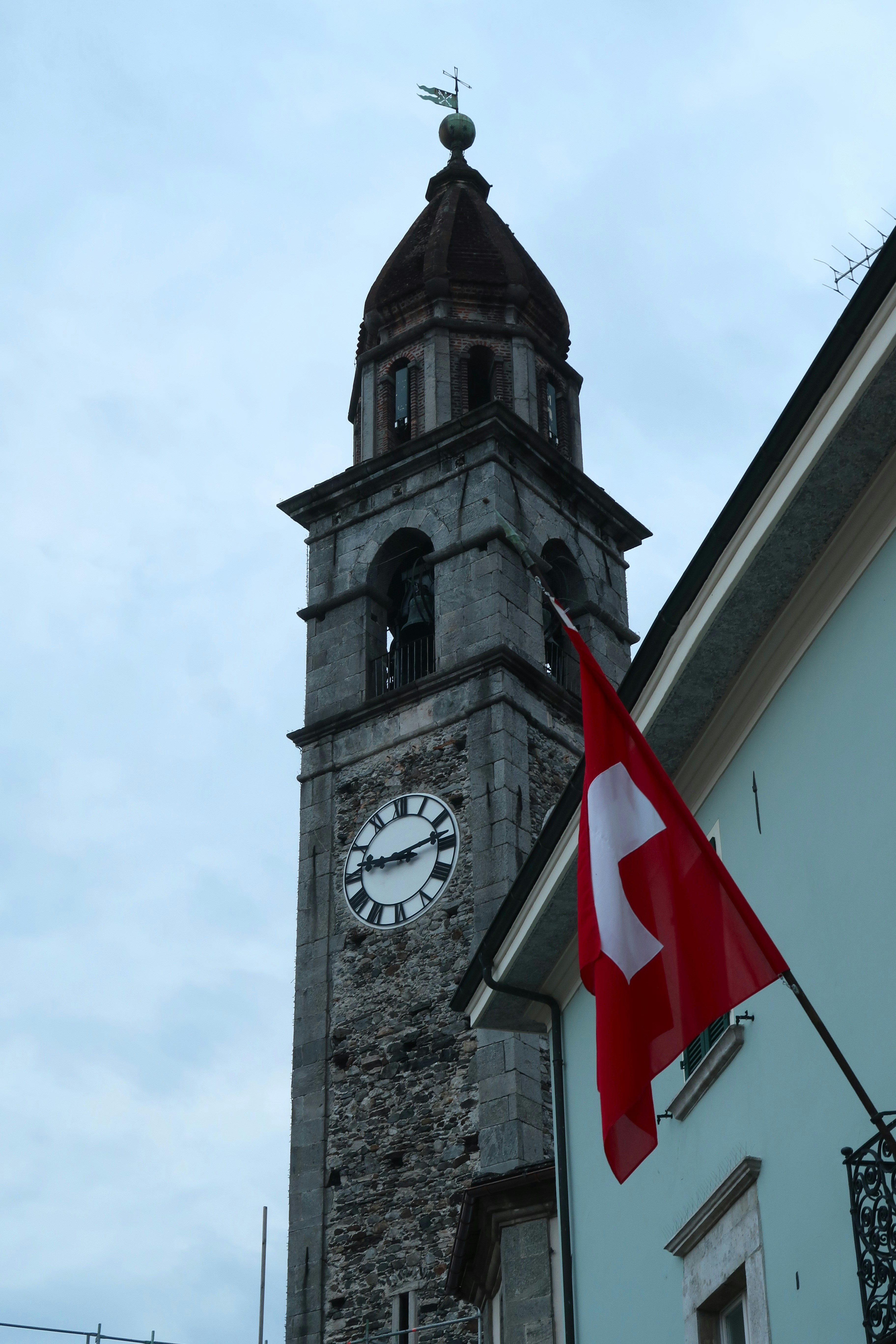 Swiss Alpine church with snow-capped peaks