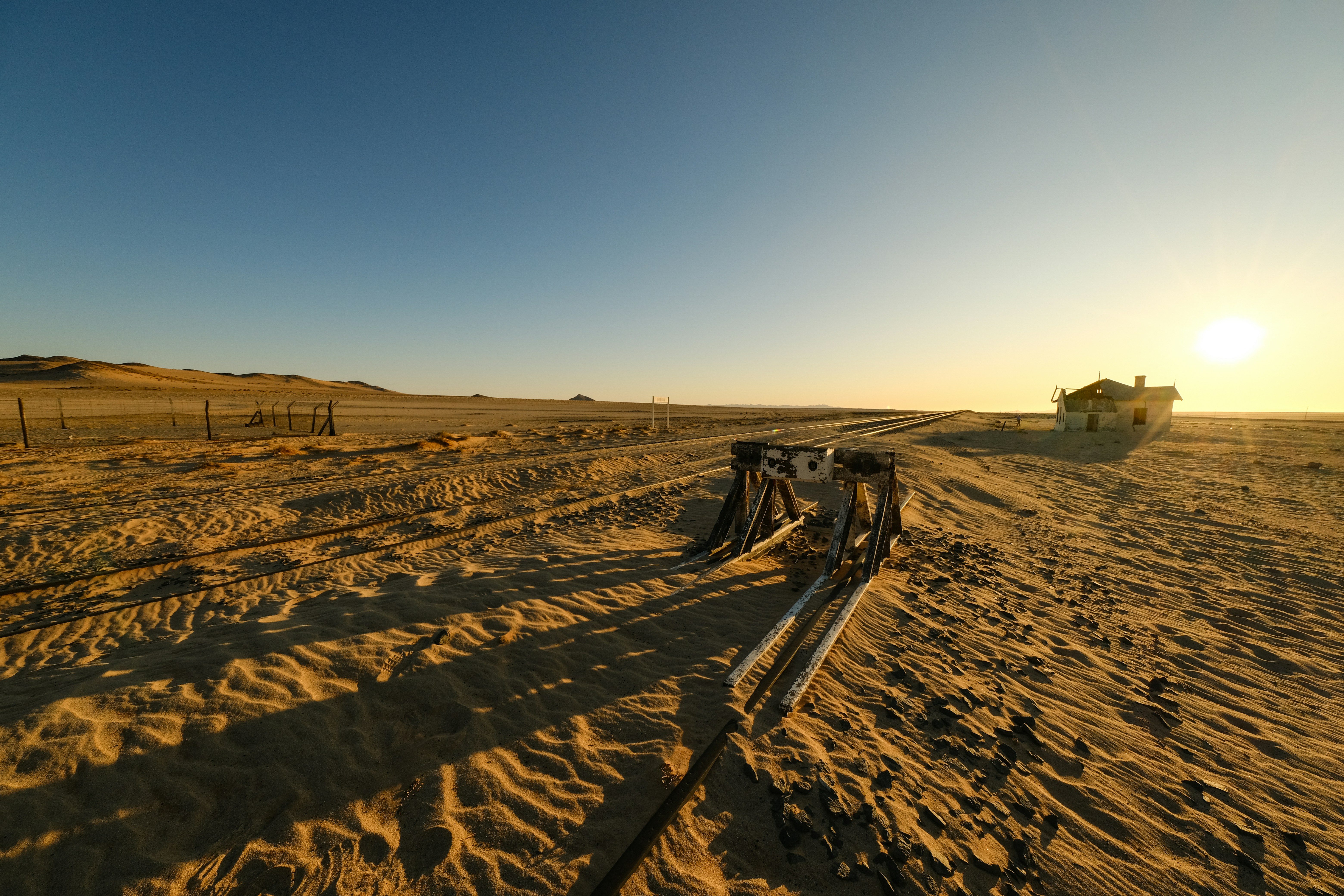 A train track in the middle of a desert