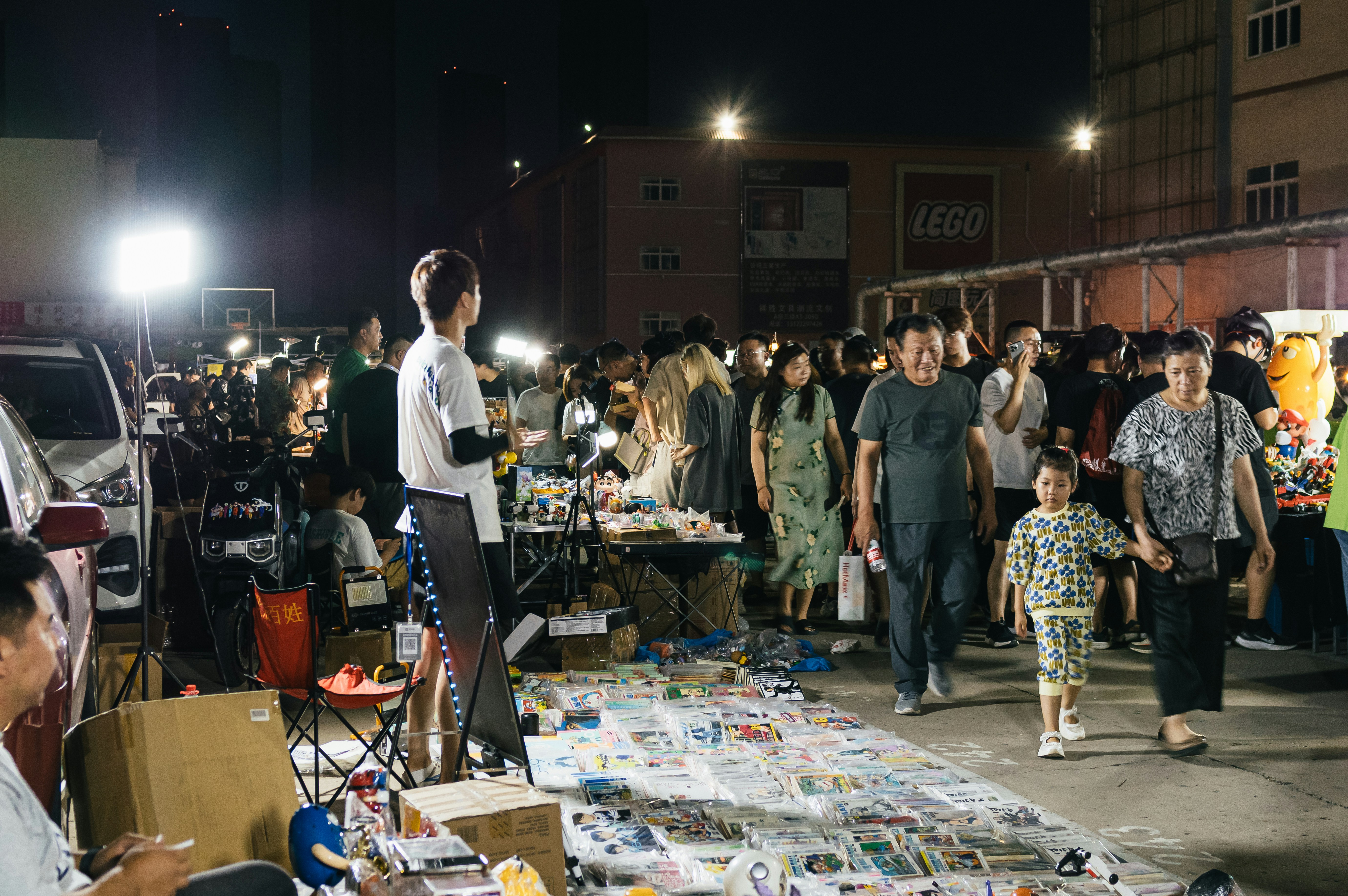 A large group of people standing around a table