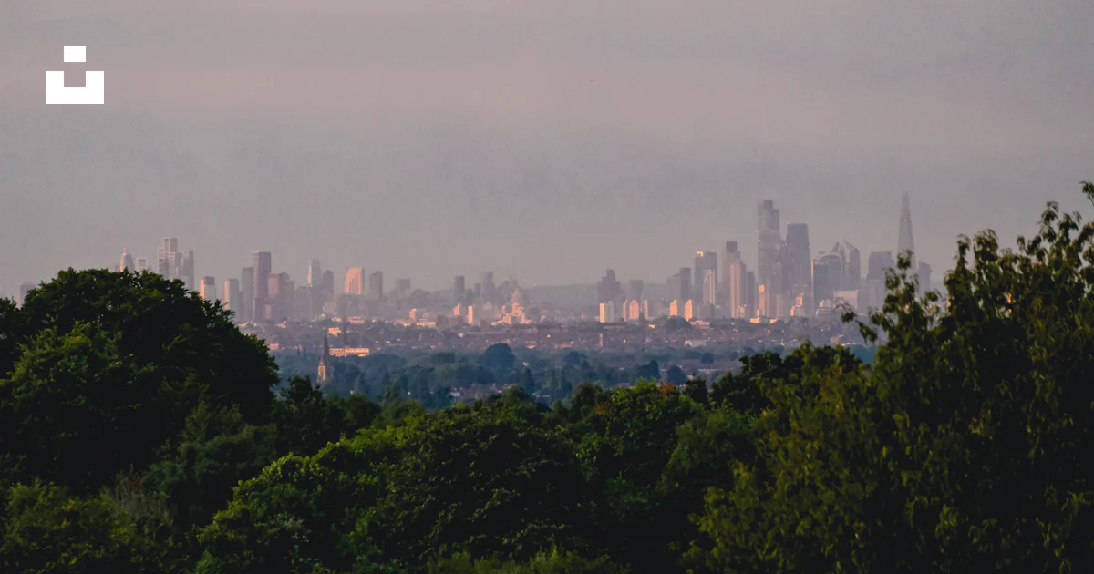 A view of a city from a distance photo – Free Landscape Image on Unsplash