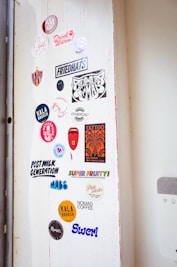 A door with a bunch of stickers on it