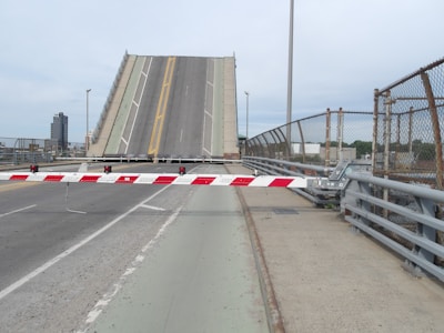 A large bridge with a red and white striped barrier