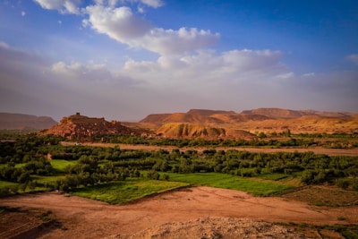 A scenic view of a valley and mountains