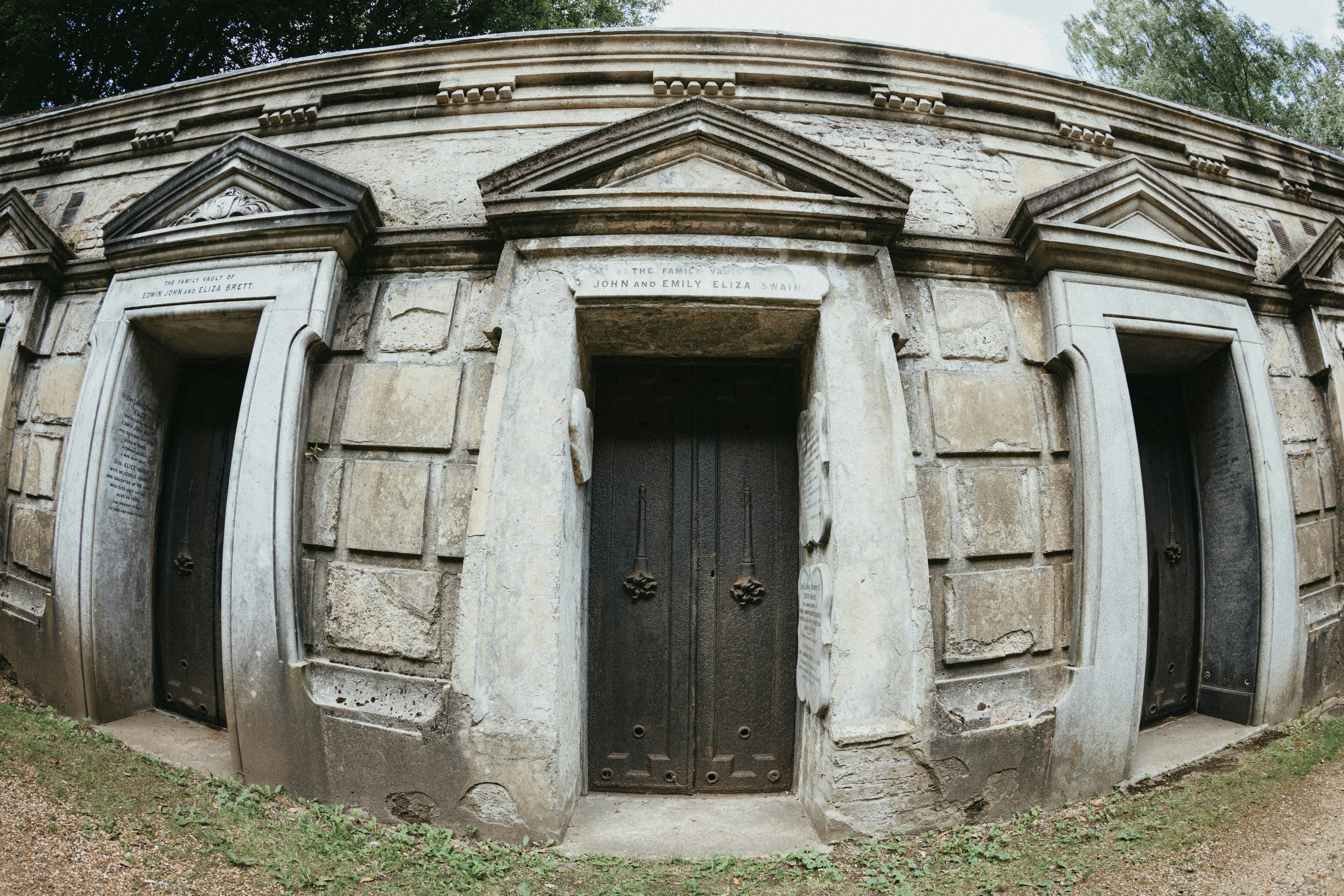 A stone structure with a door and windows